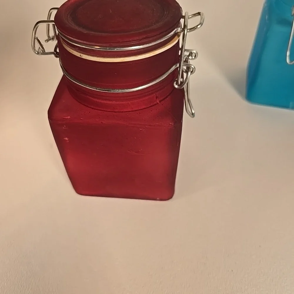 Set Of Four Colored‎ Glass Cannisters With Locking Tops Very Good Condition